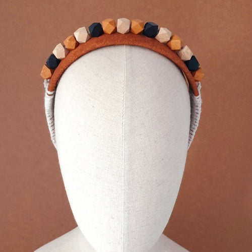 Geometric wood bead and African bark cloth headband by Martine Henry Millinery